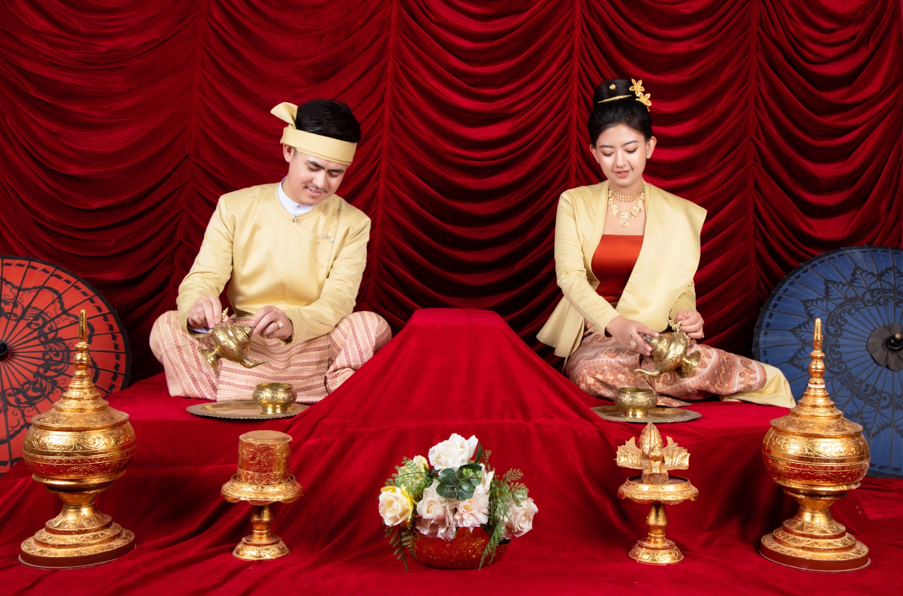 Traditional Myanmar formal set with deep red drapery