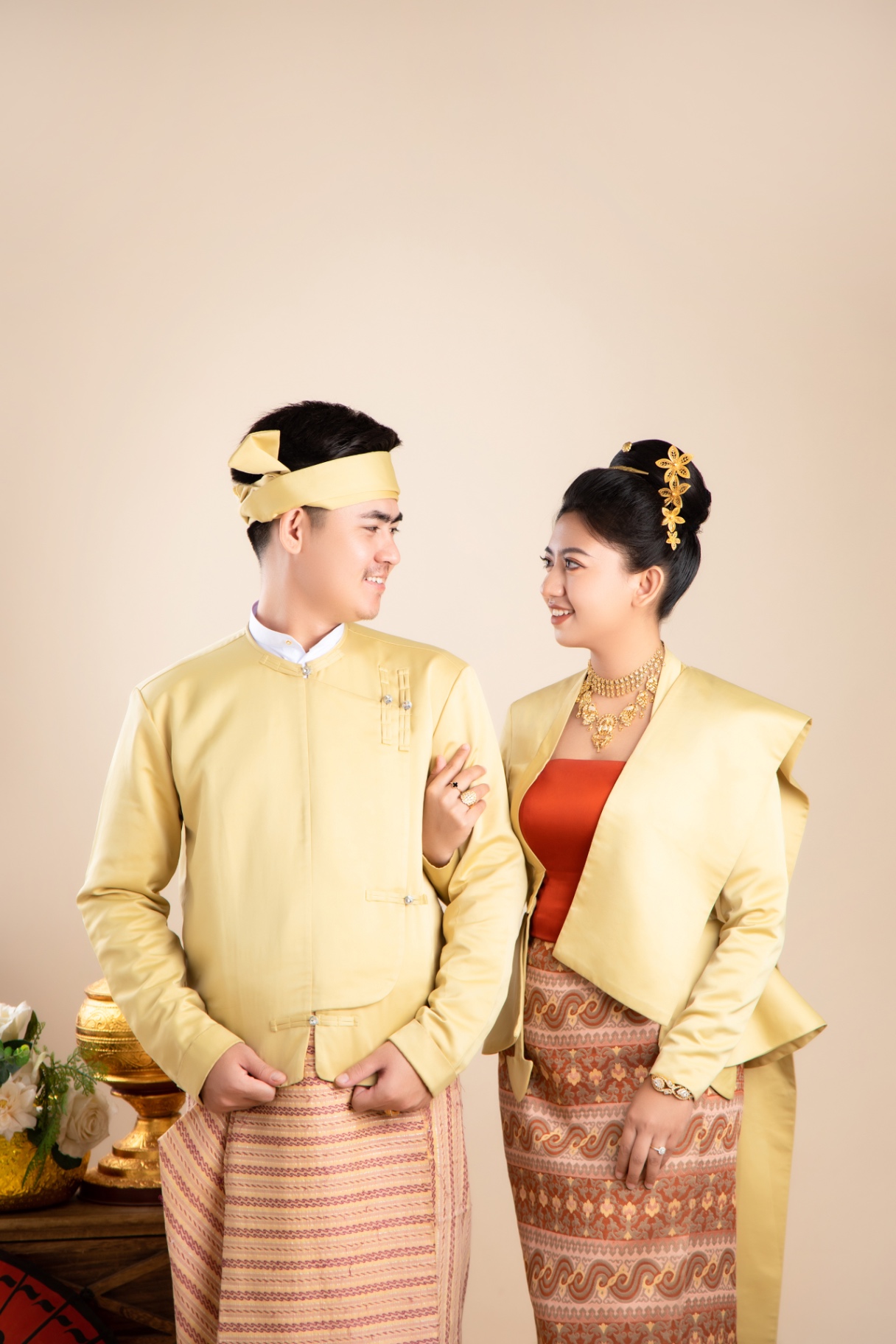 Traditional Myanmar couple sharing a warm gaze